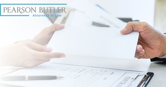 Two hands holding a piece of paper